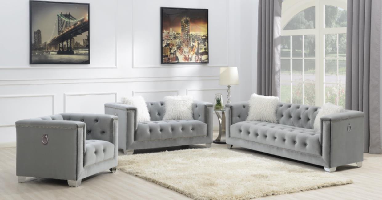 GRAY SOFA W/TWO WHITE FUR PILLOWS image 1
