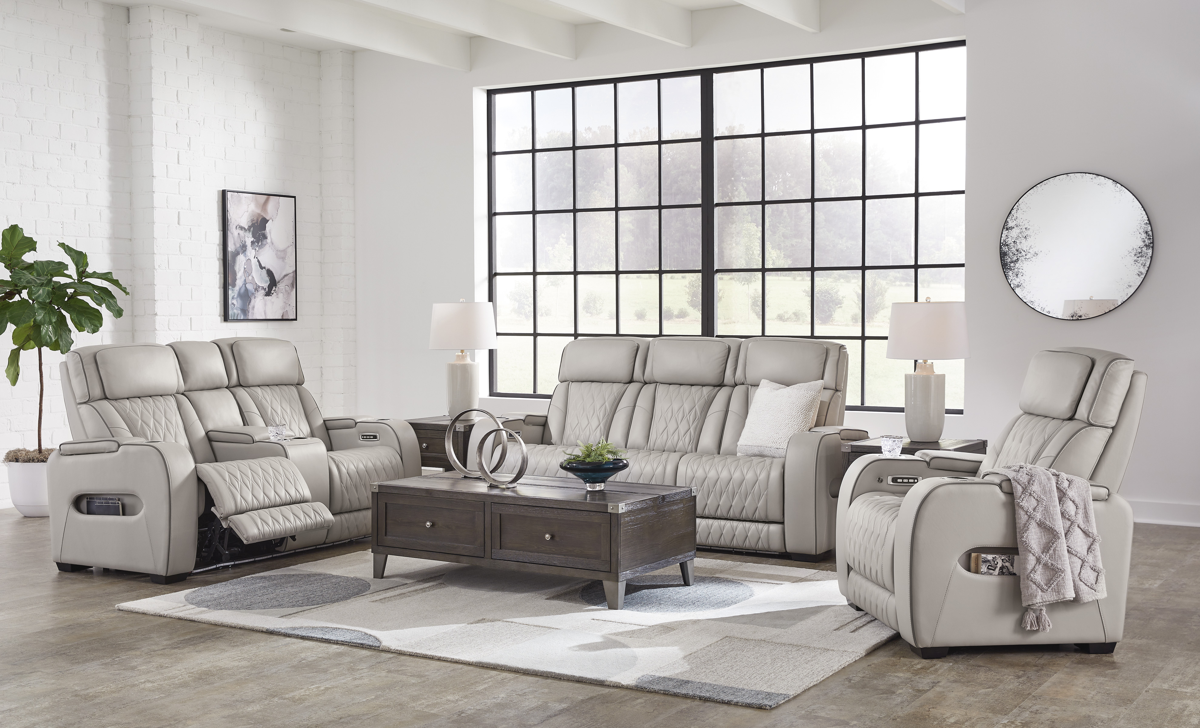 Boyington Power Leather Reclining Sofa & Loveseat + Bonus Buy Recliner + FREE 55 inch TV image 1